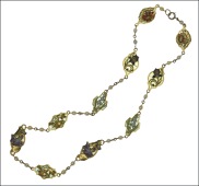 An Art Nouveau enamelled floral panel necklace, the variously shaped panel links centred both sides with polychrome...
