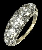A late Victorian five stone diamond ring, the five graduated old brilliant-cut diamonds with pairs of rose-cut...