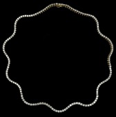 A diamond necklace of wriggle design, by Moussaieff, the diamond line necklace set with uniform brilliant-cut...