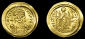 Byzantine Coinage, Justinian I, Solidus, Constantinople, helmeted bust facing, holding globus cruciger and shield,...