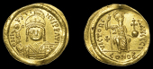 Byzantine Coinage, Justin II, Solidus, Alexandria, helmeted bust facing, holding globe surmounted by Victory and...