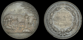 Mallow Farmers’ Club Mowing Trial, 1877, a silver award medal, unsigned, farmer and his wife rest with horse and...