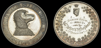 Irish Water Spaniel Club, a silver award medal, unsigned, head of a water spaniel right, rev. crowned harp and...