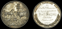 Wicklow Farming Society, a silver award medal by I. Parkes, farm animals and plough, house at right and tree behind,...