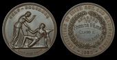 Exhibition of Irish Art and Manufactures, Dublin, 1882, a bronze award medal, unsigned [by J. Woodhouse], similar,...