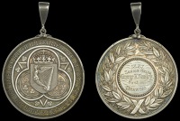 Board of INTERMEDIATE EDUCATION Ireland, a silver award medal by J.S. & A.B. Wyon, crowned Irish harp within Gothic...