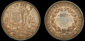 England, Metropolitan College of Pharmacy, a copper award medal, unsigned, Science standing right amidst instruments...