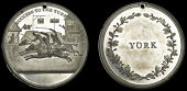 YORKSHIRE, York, white metal, unsigned, three horses passing winning-post, success to the turf, rev. york in wreath,...