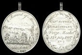 Captain Sutton’s Rifle Company, an oval silver medal, 76x58mm., with engraved design of a rifleman at target...
