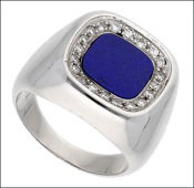 A lapis lazuli and diamond dress ring, inlaid with a cushion-shaped lapis lazuli plaque, within a surround of...
