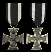 Two German Great War Iron Crosses Second Class.
The first with larger than normal size ring that is stamped with...
