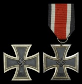 Two German Second War Iron Crosses.
A good clean Iron Cross First Class, maker marked to the pin L15...