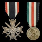 A German Second War Group of Four.
Comprising East Front Medal, reasonable finish, the silvering from the helmet...