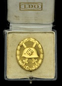 A German Second War Wound Badge in Gold.
A very nice condition number 30 marked solid construction...