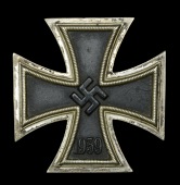 A German Second War Iron Cross First Class.
A good clean example of a non maker marked Iron Cross First Class. All...