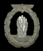 A German Second War Kriegsmarine Minesweeper Badge.
A non maker marked Minesweeper badge, which has lost all of its...