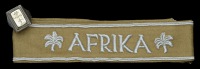 German Second War Army Soldbuch and Afrika Korps Cuff Band.
A nice soldbuch to an army medical man. The front cover...