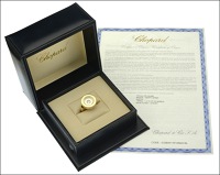 A ‘Happy Spirit’ diamond ring by Chopard, the round bezel glazed and supporting a loose mounted collet set...