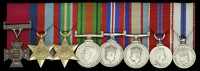 The mounted group of eight miniature dress medals worn by Private E. Kenna, V.C., 2/4 Australian Infantry Battalion,...