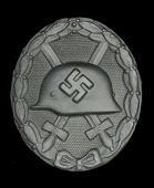 Germany, Third Reich, Wound Badge in Black, of single stamped construction, manufactured by Carl Poellath of...