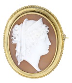 A mid 19th century shell cameo brooch, carved to depict the profile of Greek goddess Hera, to a bloomed gold mount...