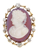 A 19th century hardstone cameo brooch/pendant, the oval cameo carved in high relief to depict a female profile with...
