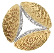 A diamond brooch, circa 1978, of modernist design, the three concave marquise-shaped panels with textured bark...