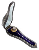 A mid 19th century gem-set stick pin, the quartz cat’s eye cabochon to a bloomed gold mount with bead work...