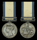 The Naval General Service medal awarded to Commander William E. Wright, Royal Navy, who served as an Able Seaman in...