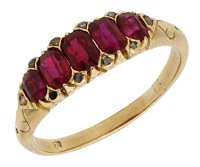 A ruby five stone ring, the graduated cushion-shaped rubies spaced by rose-cut diamond highlights, ring size Q.	...