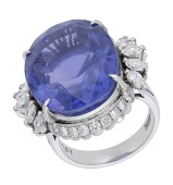 A Sri Lankan colour-change sapphire and diamond ring, the oval-cut blue-purple colour-change sapphire, weighing...
