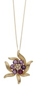 A ruby and diamond pendant, set with circular-cut rubies and brilliant-cut diamonds in a surround of textured...