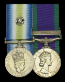 The South Atlantic and Gulf operations pair awarded to Leading Steward M. W. Devine, Royal Navy, who sustained...
