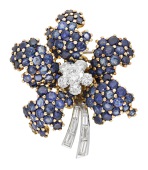 A sapphire and diamond brooch, circa 1960, designed as a flower, set with brilliant-cut diamonds to the centre and...