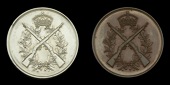 Royal North Devon Yeomanry Regimental Shooting Medal (2), 38mm, silver, the obverse featuring crossed rifles, with...