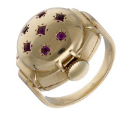 Nadine. A lady’s gold and ruby-set ring watch, circa 1950.
Movement: manual winding, 17 jewels.
Dial: silvered,...