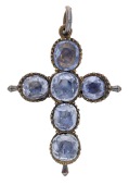 An early 19th century sapphire cross pendant, the Latin cross composed of six mixed-cut sapphires in closed-back...