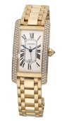 Cartier. A lady’s gold and diamond-set automatic rectangular wristwatch with date and bracelet, Ref. 2483,...