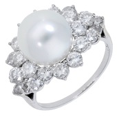 A cultured pearl and diamond cluster ring, the cultured pearl, measuring approximately 11.3mm, within a...
