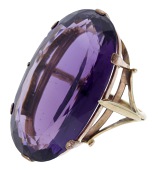 An amethyst dress ring, set with an oval-cut amethyst, ring size P½.  £160-£200