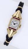 Swiss. A lady’s gold and synthetic ruby-set wristwatch, circa 1952.
Movement: manual winding, 17 jewels.
Dial:...