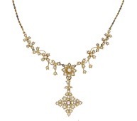 An early 20th century seed pearl necklace, the ropetwist chain leading to a seed pearl frontispiece of foliate...