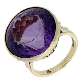 An amethyst ring, 1985, the circular-cut amethyst in an openwork basket setting, mounted in 18ct gold, London...
