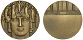 FRANCE, Théatre, 1930, an Art Déco bronze award medal by M. Delannoy, head of Apollo encircled by a halo, Cupid...