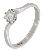 A diamond single stone ring, the brilliant-cut diamond between crossover shoulders, mounted in 18ct gold, UK...