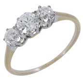 A diamond ring, set with three graduated old brilliant-cut diamonds, total diamond weight approximately 0.90 carat,...
