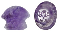 A carved amethyst seal, of mushroom form, the base intaglio carved with a rose spray above the black letter initials...