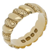 An 18ct gold ring, 1894, the diagonal rounded bands alternately plain and foliate engraved, London hallmark,...