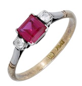 A synthetic ruby and diamond ring, the square-cut synthetic ruby between single-cut diamond shoulders, stamped...