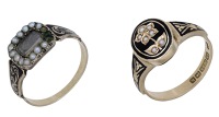 Two antique mourning rings, each with black enamel, seed pearl and foliate motif decoration, central and reverse...